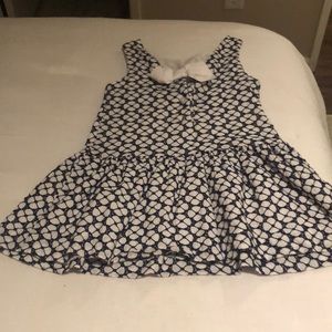 Blue and white floral top with bow detail in back